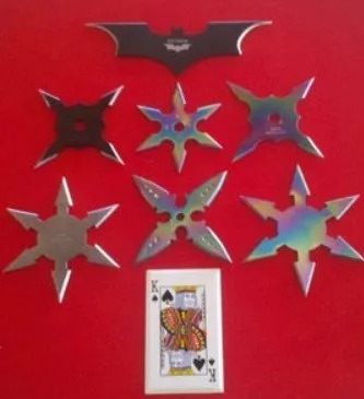 Throwing stars and shuriken arranged on a red display board